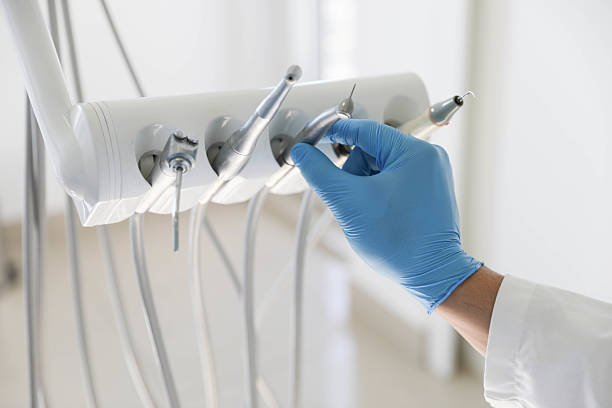 Professional Tooth Extraction technician working in Howard County County, AR